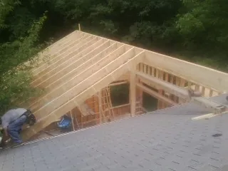 Framing a new roof addition that ties into an existing shingle roof in Hampton